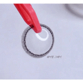LensRang Sharing Gray — contact lens held with tweezers