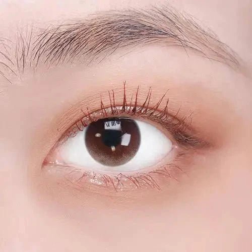 LensTown Joy Nude Brown — single-eye close-up showing the contact lens appearance
