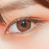 LensTown Kakao Friends Apeach Brown — single-eye close-up showing the contact lens appearance