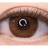 LensTown Kakao Friends Apeach Brown — single-eye close-up showing the contact lens appearance