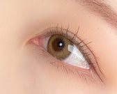 LensRang Comely Brown — single-eye close-up showing the contact lens appearance