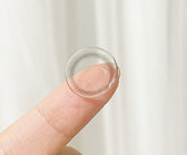 LensRang iWWi Iwwing Black — contact lens held on a fingertip