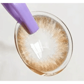 LensTown Thrice S Brown — contact lens held with an applicator