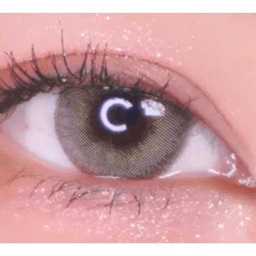 LensVery Silhouette1 Olive Brown — single-eye close-up showing the contact lens appearance