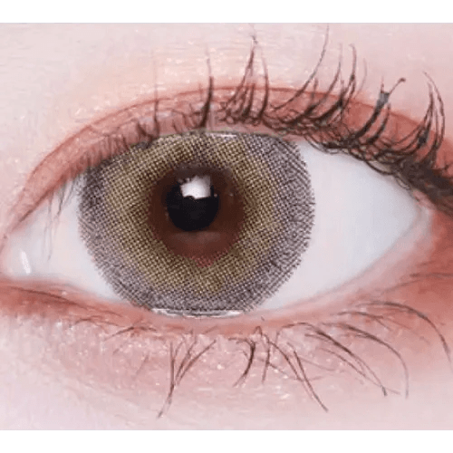 LensVery Silhouette1 Olive Brown — single-eye close-up showing the contact lens appearance