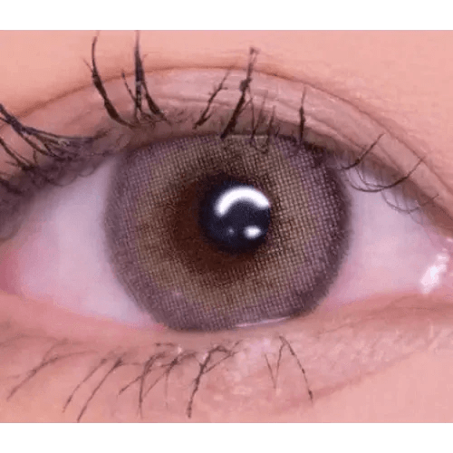 LensVery Silhouette1 Olive Brown — single-eye close-up showing the contact lens appearance