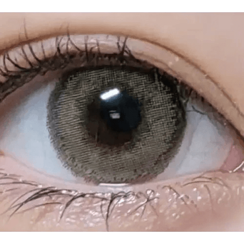 LensVery Silhouette1 Olive Brown — single-eye close-up showing the contact lens appearance
