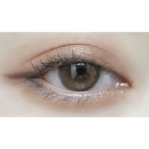 Olens Loving U Brown — single-eye close-up showing the contact lens appearance