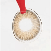 LensTown Mio Blonde Hazel — contact lens held with tweezers