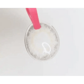 LensTown New Vanilla Candy Green — contact lens held with tweezers