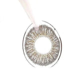 LensTown Not Bad Brown — contact lens held with tweezers