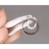 LensTown Nudy Coco Brown — contact lens held on a fingertip