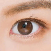 LensTown Nudy Coco Brown Toric — single-eye close-up showing the contact lens appearance