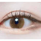 Olens Shining Pure Brown — single-eye close-up showing the contact lens appearance
