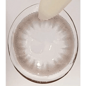 Olens Shining Pure Choco — contact lens held with tweezers