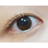 Olens Shining Pure Choco — single-eye close-up showing the contact lens appearance