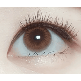 Olens Someday Brown — single-eye close-up showing the contact lens appearance
