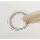 Olens Spring Rain Gray — contact lens held with tweezers