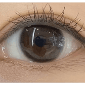 Olens Stay Black — single-eye close-up showing the contact lens appearance