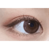 Olens Tika Chocolate Brown — single-eye close-up showing the contact lens appearance