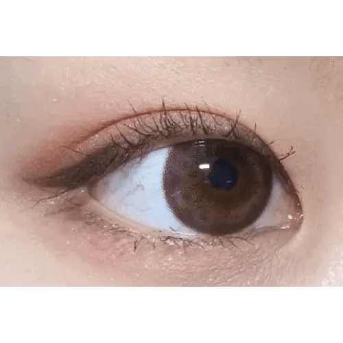 Olens Tika Chocolate Brown — single-eye close-up showing the contact lens appearance