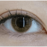 Olens TT 1 Brown — single-eye close-up showing the contact lens appearance