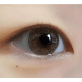 Olens W1 Brown — single-eye close-up showing the contact lens appearance