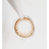 LensTown Pocopong Brown — contact lens held with tweezers