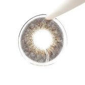 LensTown Renaissance Brown — contact lens held with tweezers