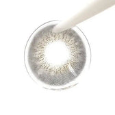 LensTown Renaissance Gray — contact lens held with tweezers