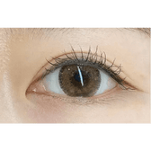 Olens Rich Brown — single-eye close-up showing the contact lens appearance