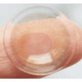 LensTown Romantea London Brown — contact lens held on a fingertip