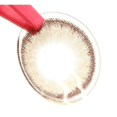 LensTown Romantea Rome Brown — contact lens held with tweezers