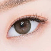 LensTown Romantea Rose Nude Brown Toric — single-eye close-up showing the contact lens appearance