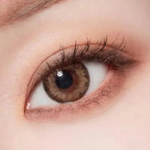 LensTown Romantea Tokyo Peach Brown — single-eye close-up showing the contact lens appearance