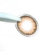 LensTown Romantea Tokyo Peach Brown — contact lens held with tweezers