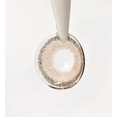 LensTown Rose Swan Brown Topaz — contact lens held with an applicator