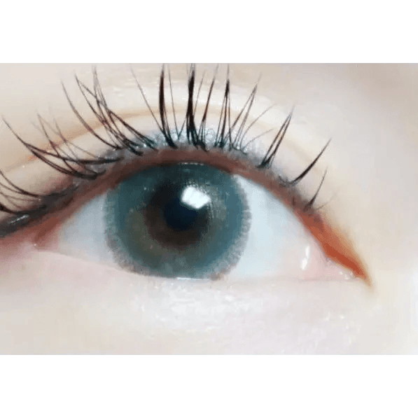 LensTown Rose Swan Green Emerald — single-eye close-up showing the contact lens appearance