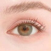 LensTown Rose Swan Green Emerald — single-eye close-up showing the contact lens appearance