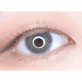 LensTown Rose Swan Green Emerald — single-eye close-up showing the contact lens appearance
